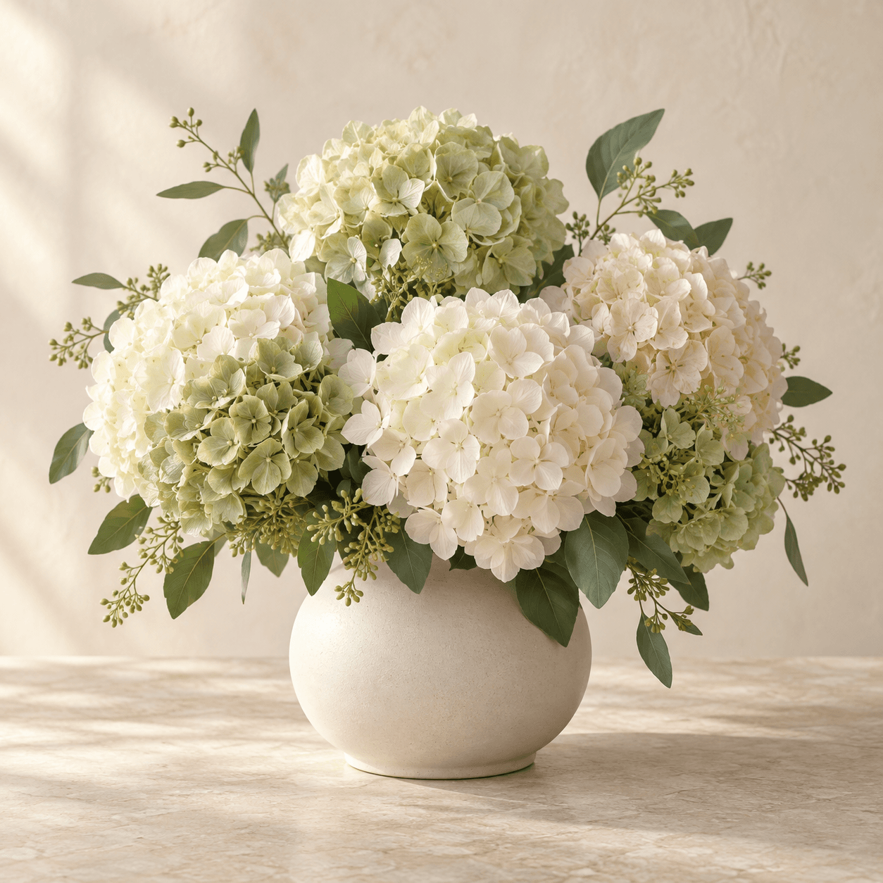 Temporary collection image of ivory and pale sage hydrangeas in a ceramic vase